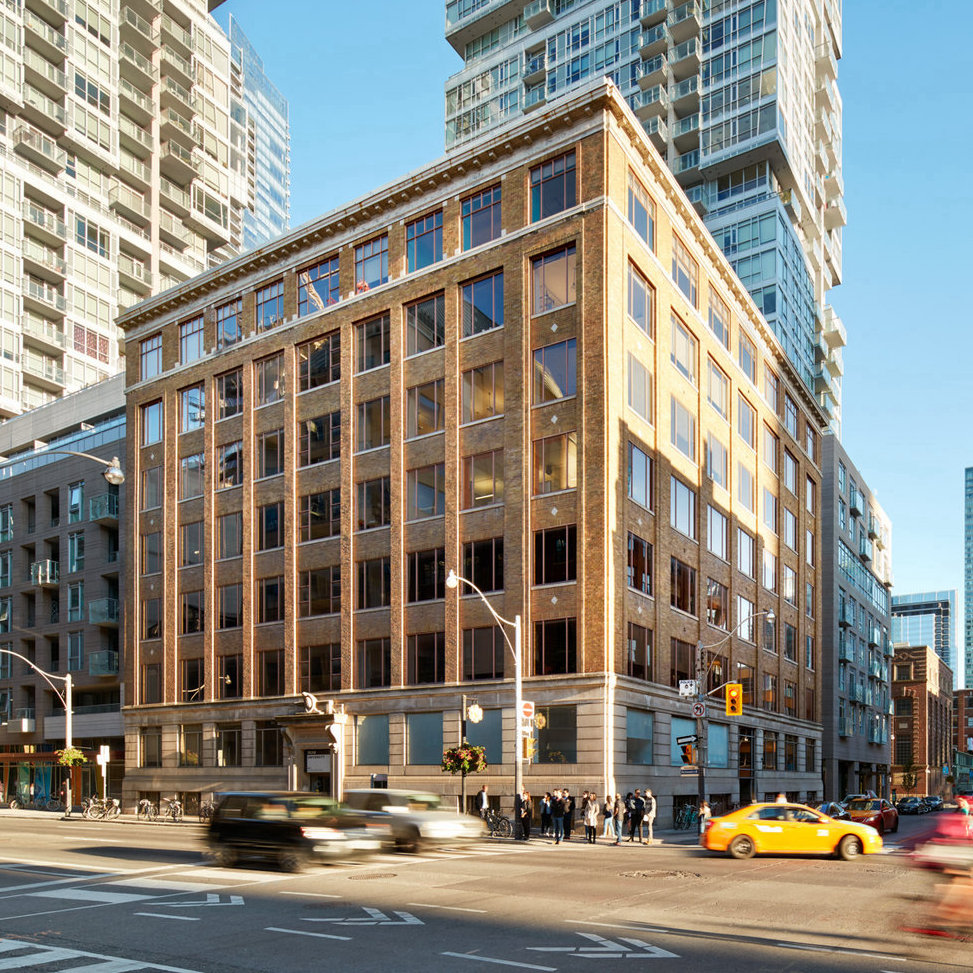 A square, brown building with many square windows at 205 richmond St. West