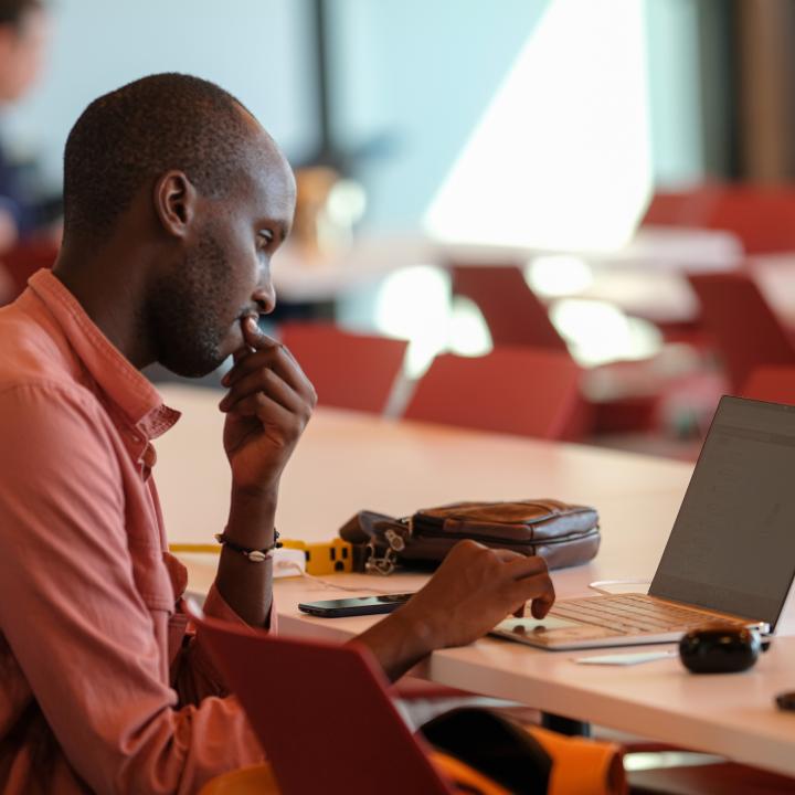 Person working at laptop screen 