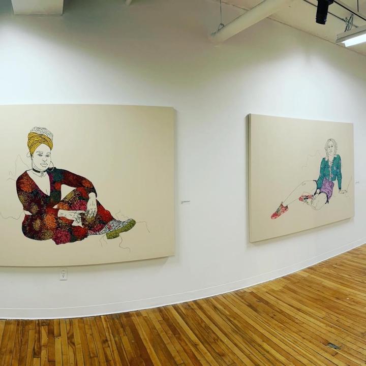 Two large embroidered portraits from Swaby's gallery exhibition.